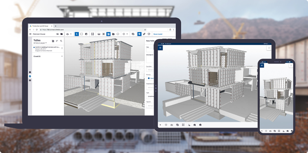 Laptop, tablet, and phone displaying the same building model in a collaborative 3D/BIM viewer.