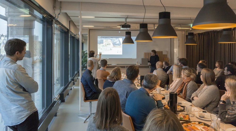 A weekly communal lunch + internal design presentation in progress