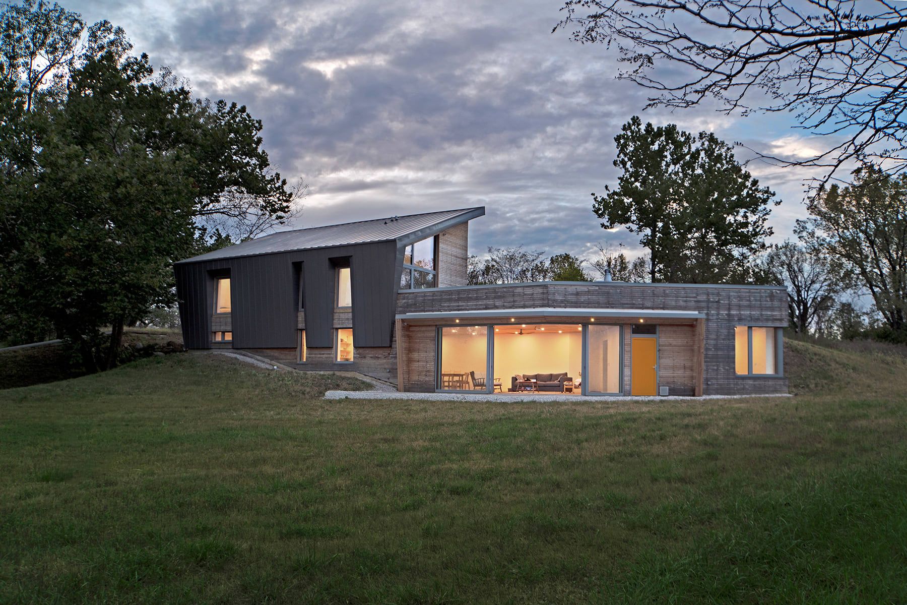 A modern building on a patch of grass