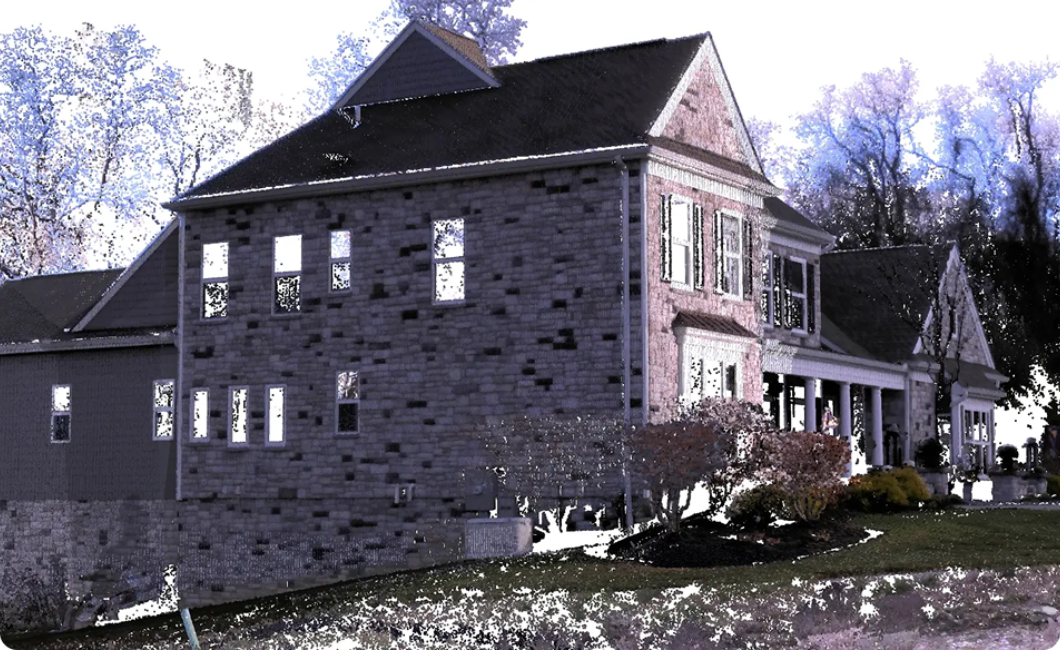Stone exterior suburban house with gabled roof, many windows, front porch, and landscaped yard in daylight.