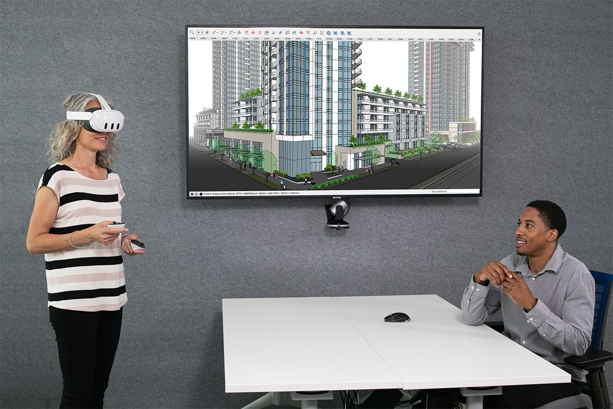 Project stakeholders in a conference room use virtual reality presentation technology in the new SketchUp Viewer for Meta Que