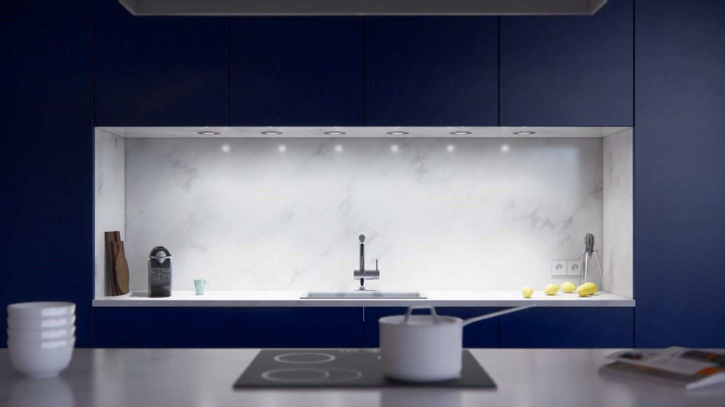 White light underneath a kitchen cabinet.