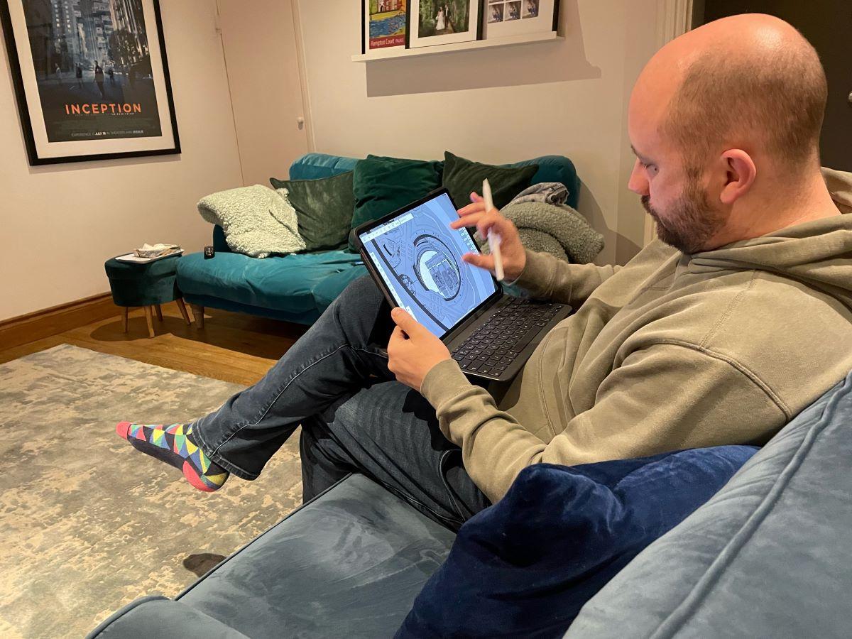 Luke modeling on iPad from his couch