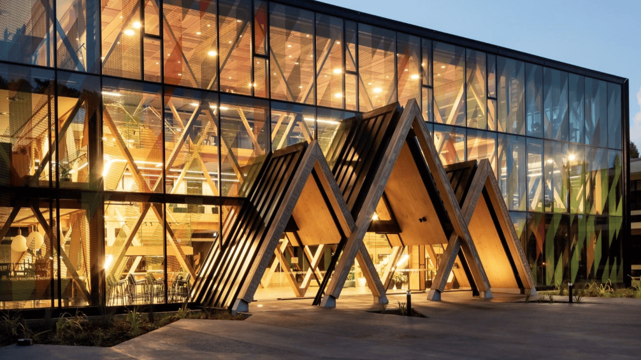A well-lit facade welcomes visitors into the Scion Innovation Hub.