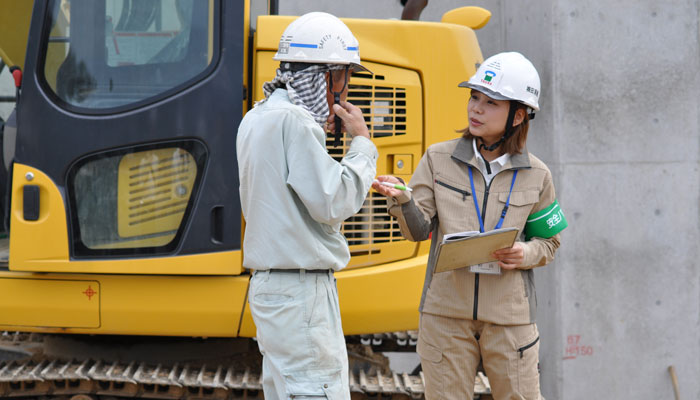 Female employee conducting a monthly inspection patrol at a construction site.