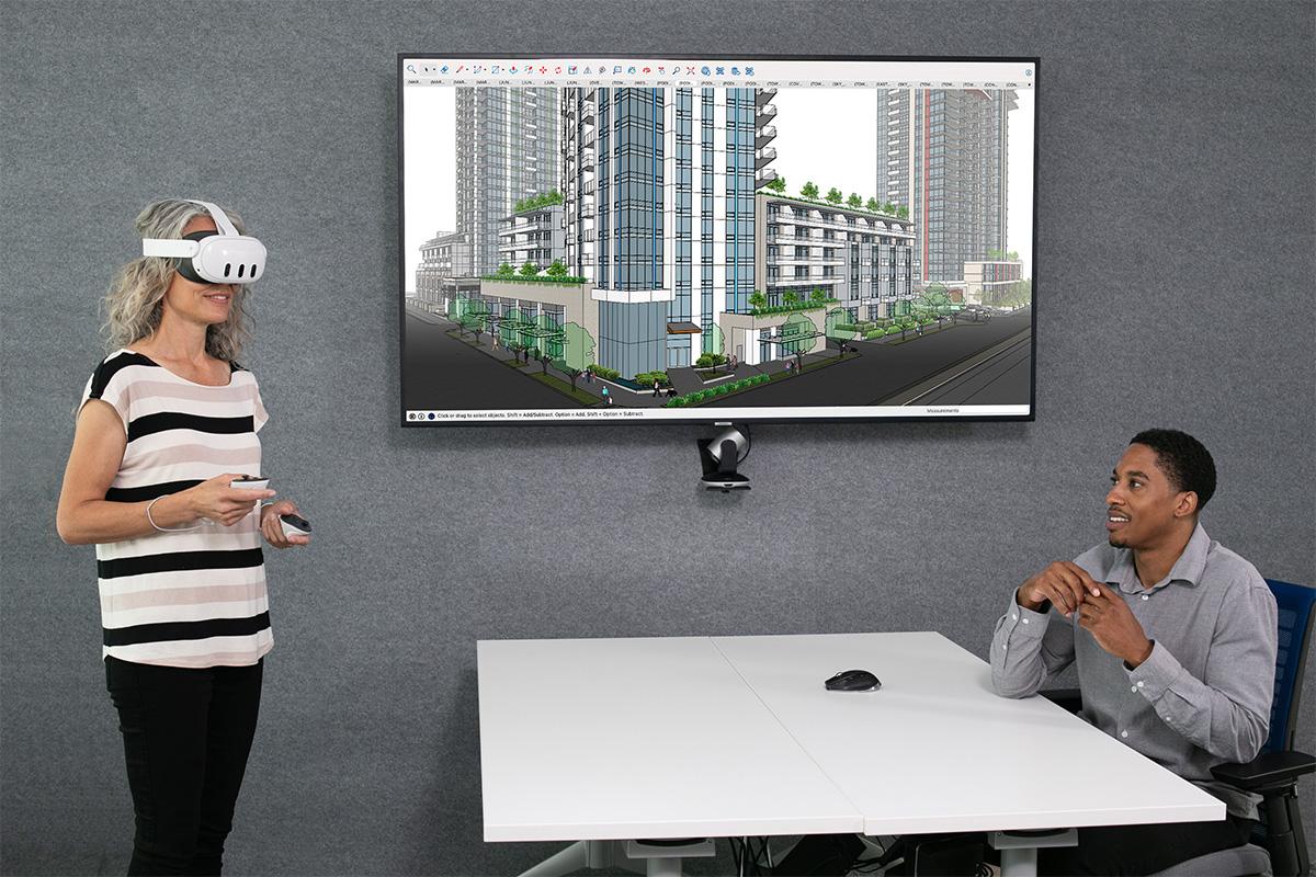 Project stakeholders in a conference room use virtual reality presentation technology in the new SketchUp Viewer for Meta Que