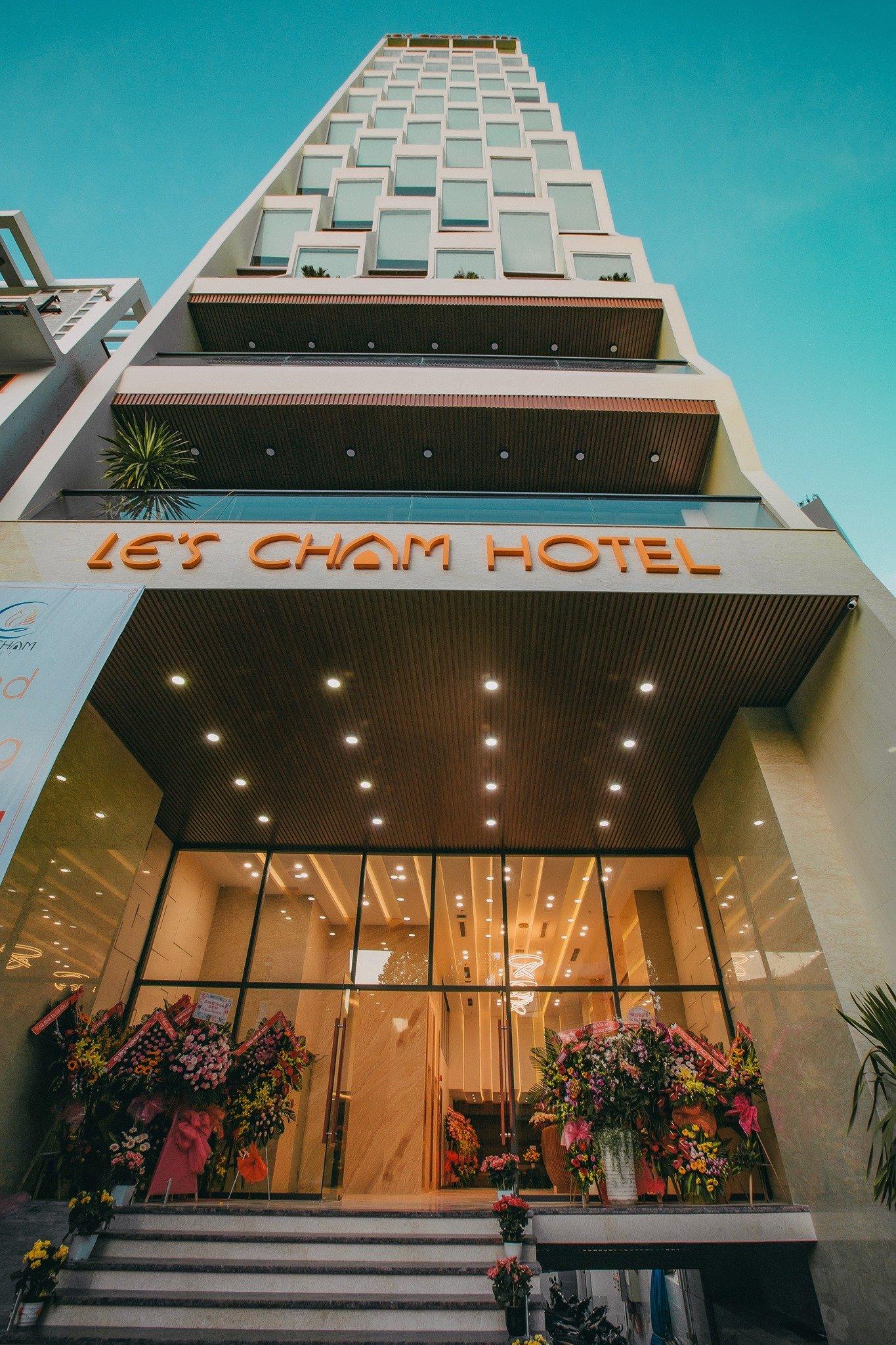 The completed Le’s Cham Hotel during its grand opening in 2019, with its glamorous facade and inviting interior.