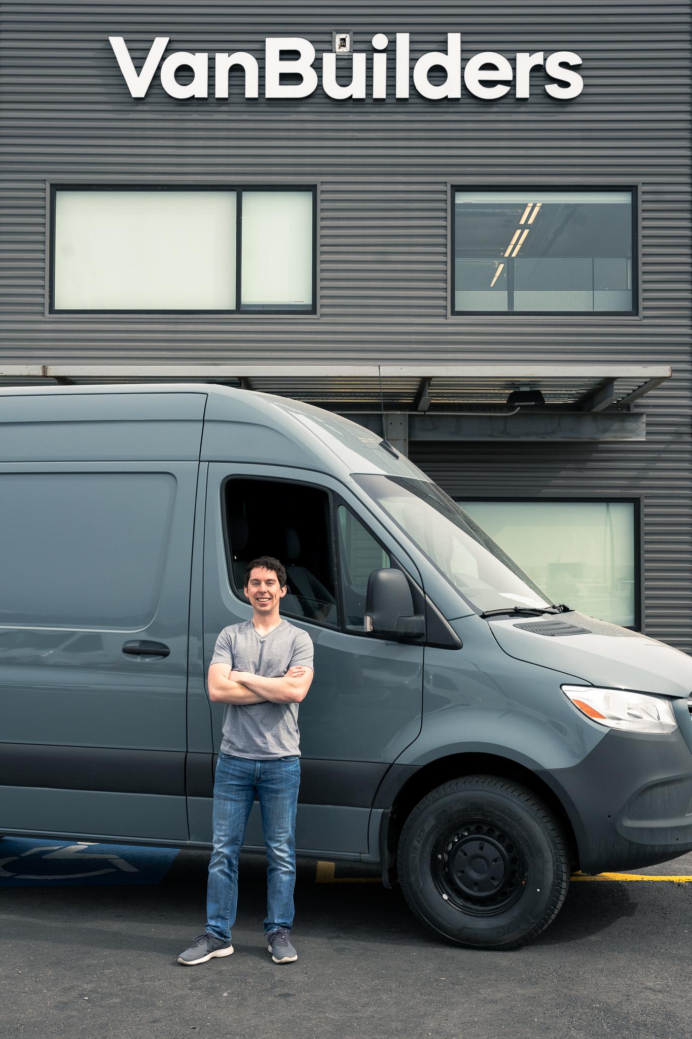 Dayton in front of one of his sprinter van builds