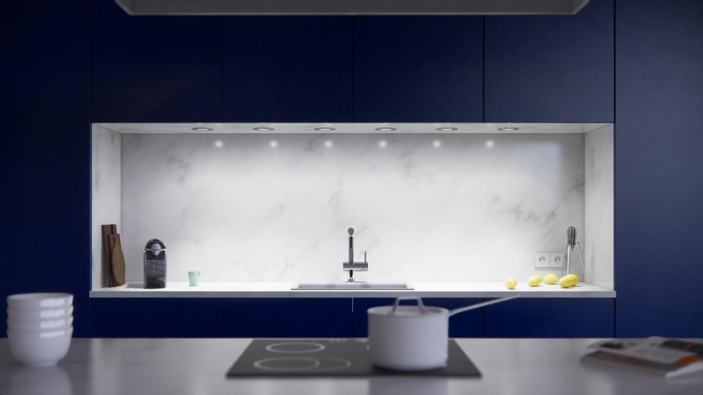 White light underneath a kitchen cabinet.